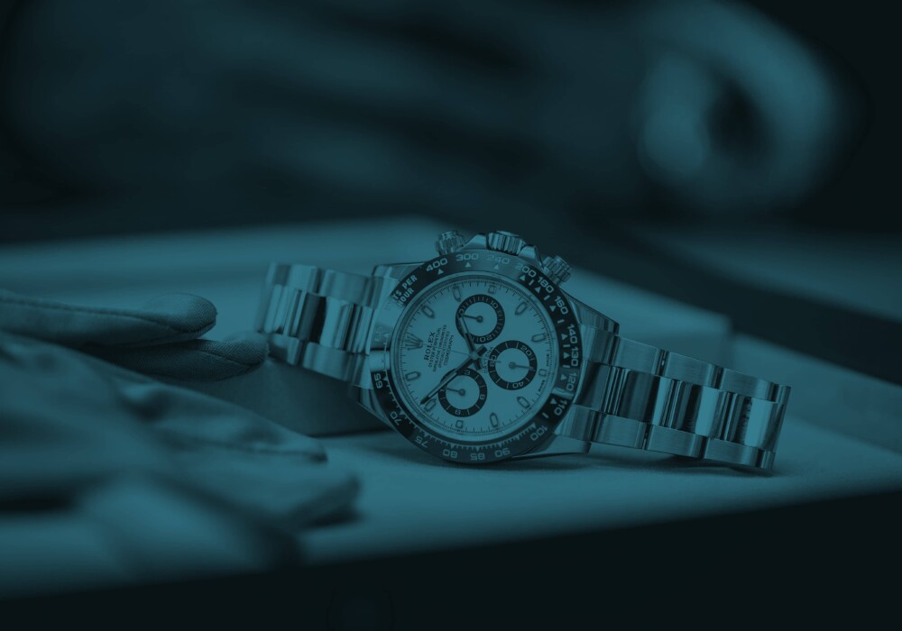 Luxury Rolex watch placed on a velvet tray, representing high-value items covered by Hepburns travel insurance